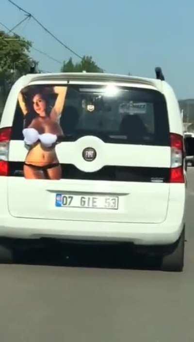 Windshield wiper that flashes boobs.