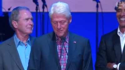 George W. Bush getting a little handsy with Bill Clinton
