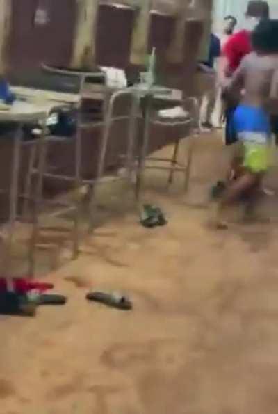 The girl in the pink bikini puts herself in the middle of a fight, and ends up being slammed on her neck by some guy!