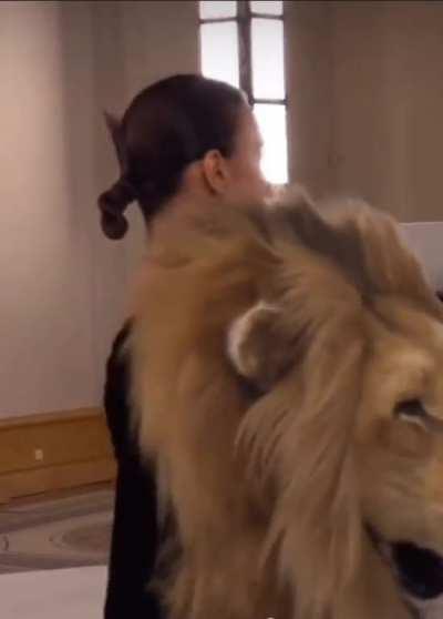 Fan attends fashion show wearing same dress as model