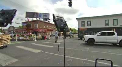 Reporter comes under fire at the George Floyd memorial in Minneapolis. One person is being treated at the hospital after being shot