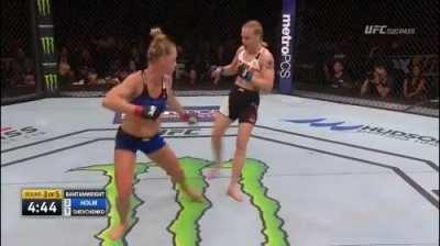 Valentina Shevchenko cuts the angle and counters Holly Holm's oblique kick with a calf kick