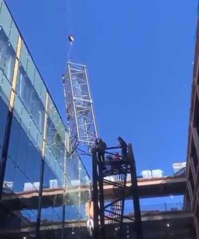 Heavy crosswind causes tower crane disassembly to go terribly wrong