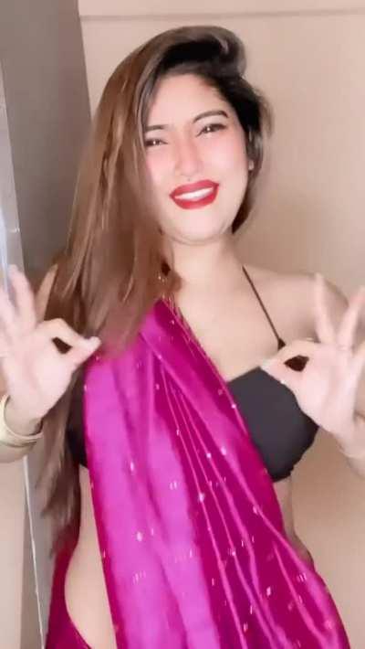 [Sexy] [Indian] pale skin curvy babe with huge milky boobs dancing in revealing saree [GIF]