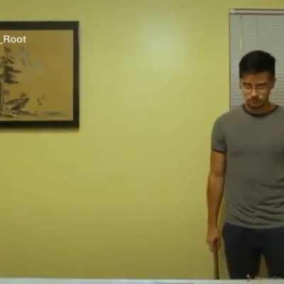 Smashing a rubix cube with a hammer on a glass table