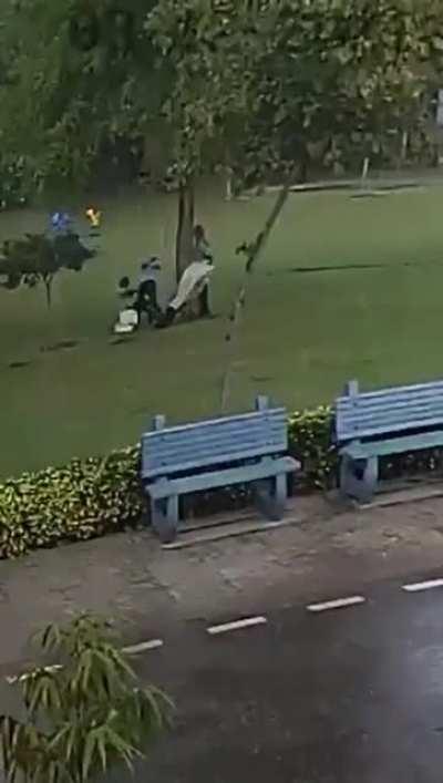 Standing under a tree in the middle of a massive storm