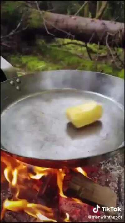 Making delicious homemade pasta in the woods over a campfire