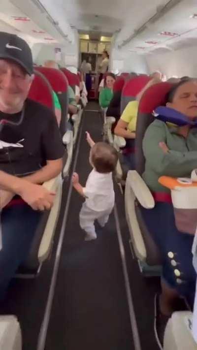 A kid saying hello to everyone