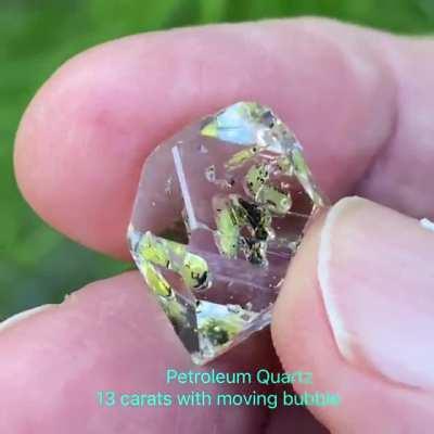 Petroleum Quartz from Pakistan. 13 carats. Contains petroleum, anthracite, and a moving gas bubble. Also reacts to UV light