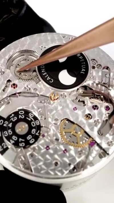Man demonstrates the making of a Swiss watch