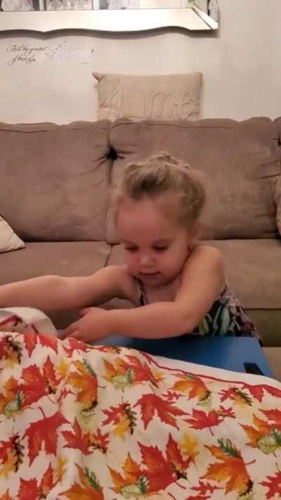 My 3 year old is now into magic tricks. This is her very first attempt, this was the simplest thing I could think of to teach her. Any suggestions on extremely simple tricks for her to practice? Thank you in advance.