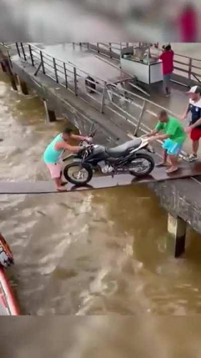 WCGW pushing a motorcycle into a boat