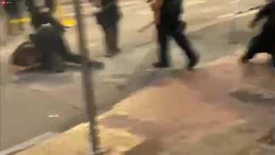 Seattle police engage black bloc rioters which had been breaking windows and were waiting at a burning roadblock for them