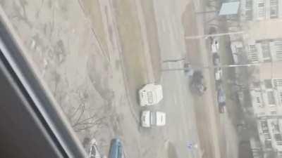 fire exchange in the middle of a city + tank drove in civilian car