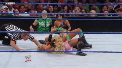 McCool making an example out of the inferior diva, completely dominating and toying with the blonde Barbie