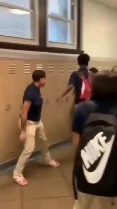 This dude breakdancing while there is a fight