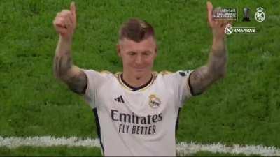 Toni Kroos goes in front of the Real Madrid fans with his children as he stands and cherishes the fans singing his name for the last time at Santiago Bernabeu.