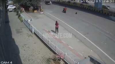 Speeding car falls off flyover in India, hits woman below waiting for the bus