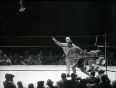 Dropped and trailing on all cards, Rocky Marciano turns Jersey Joe Walcott's face to mush with his famous Suzy Q punch in the 13th round. September 23, 1952.