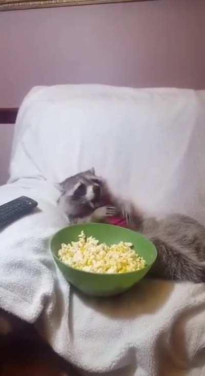 Funky dude eating some popcorn