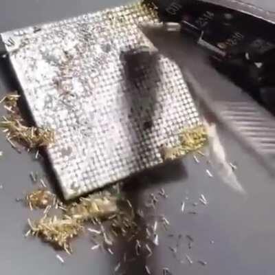 Be sure to clean off the yellow manufacturer pins before installing CPU