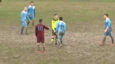 Footballer tries to kick the referee down after being sent off
