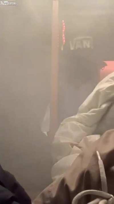 College girl lighting fireworks inside the dorm