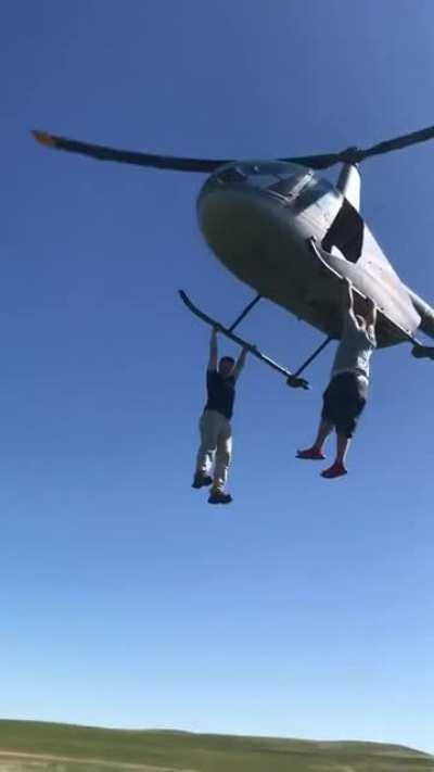 Hanging from helicopter