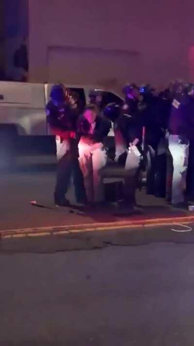 Portland police removing journalist's press badge and stealing her cash from her pockets as she vomits from tear gas exposure. Portland police arrested her for walking across the street.