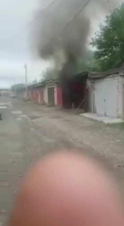 Casually wandering over to look at a shed on fire