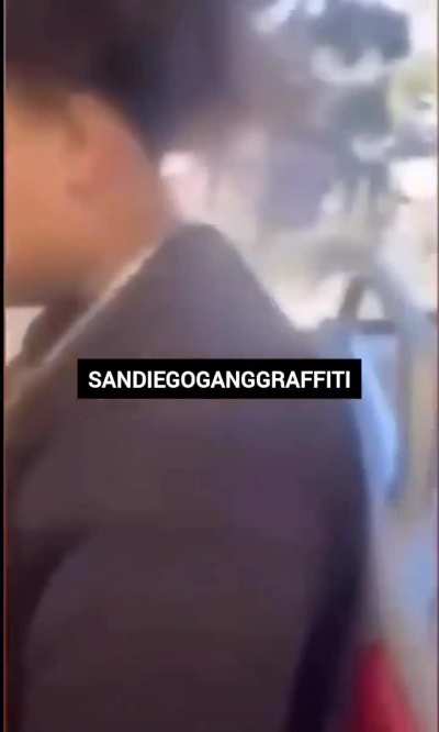 NHC Rollin 40's Crips take SKYLINE PARK BLOODS member's flag 'Bandana' rag on the trolley in Southeast San Diego, California.