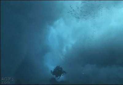 Diver gets eaten by a wave