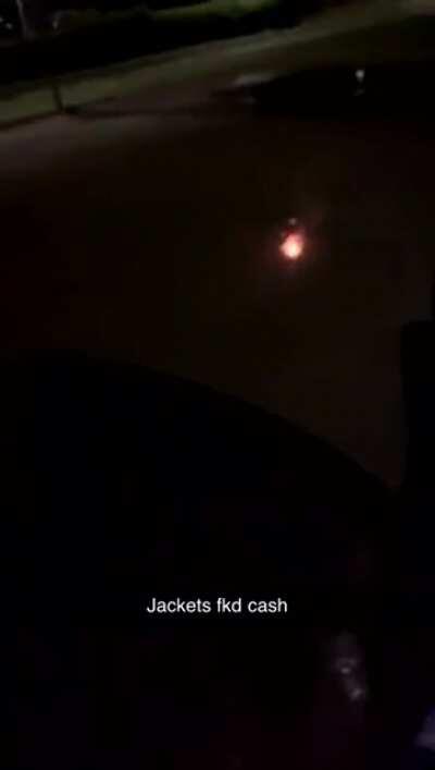 Playing with fireworks on the road.