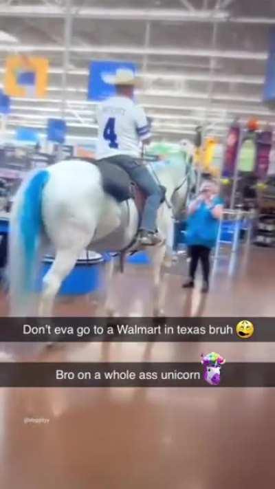 Guy riding a Whole Unicorn in Walmart
