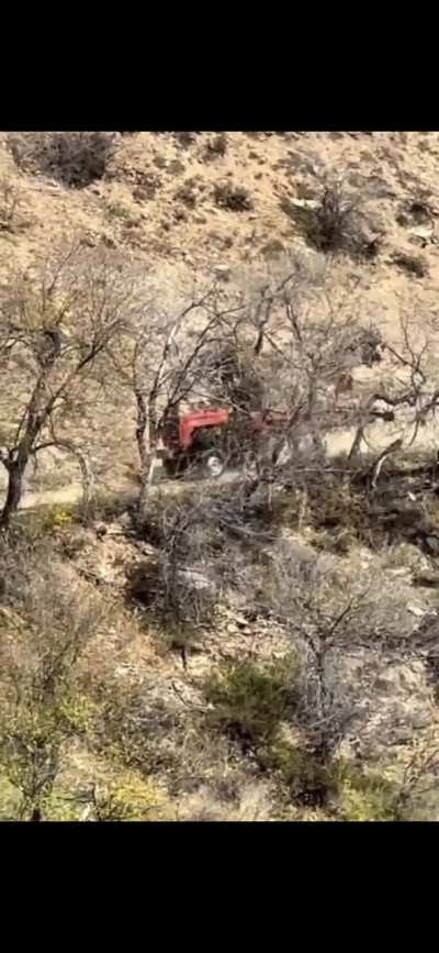 Ancient Russian tractor going downhill