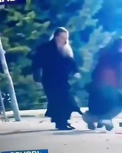 Serbian priest saves a protester from getting kidnapped by undercover police