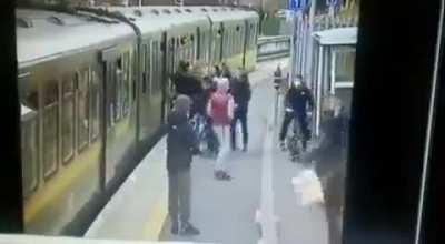 man in india kicks girl under train