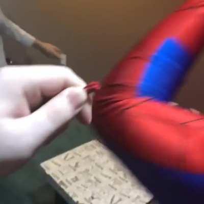 My friend got stuck in a Spider-Man costume