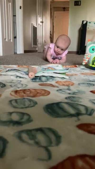To try to record her daughter crawling for the first time