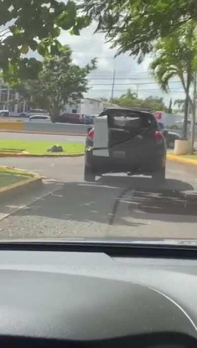 Idiot transporting a chest freezer