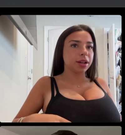 Alexa touching her shirt