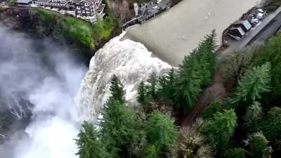 Washington state Snoqualmie Falls swell during the atmospheric river passing through the region