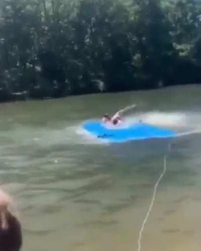 Throwing a snake in a lake.