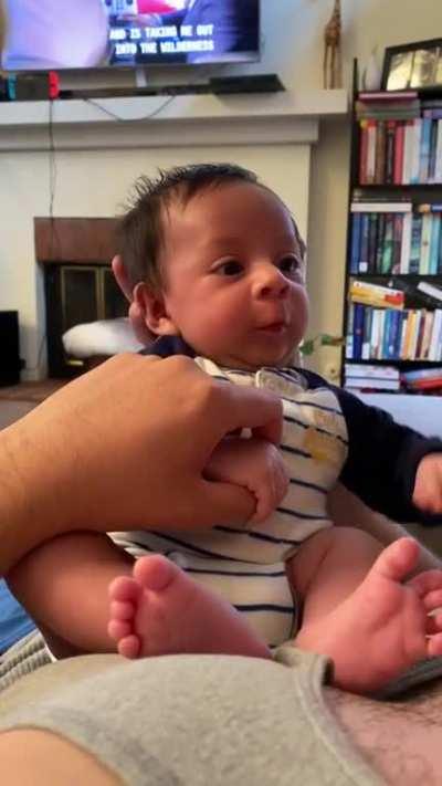 Teaching the baby to stick tongue out