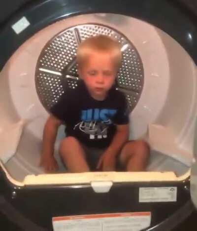 Kid didn't want to leave the washing machine