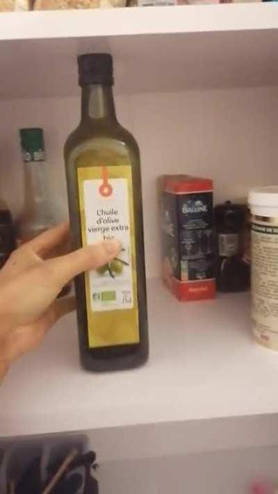 Bottle of olive oil fitting perfectly in the new shelf
