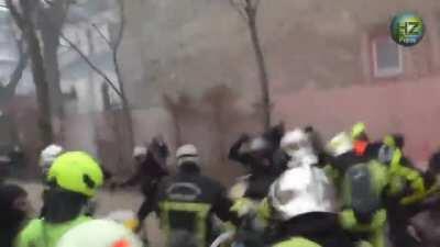 French police charging firefighters, firefighters not having any of it