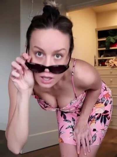 Flashing her cleavage