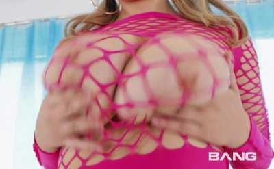 Huge boobs in pink fishnet top