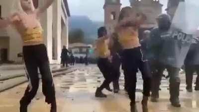 A group of trans and non binary people voguing as a way of facing the police, at yesterday's protest in Colombia